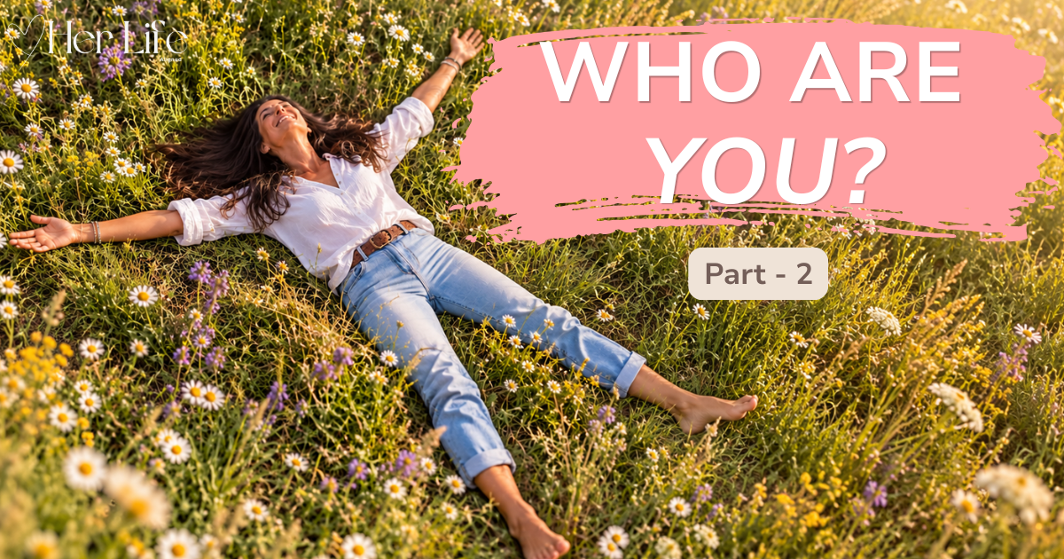 A woman lying joyfully with her arms outstretched in a wildflower meadow, representing freedom, identity and new possibilities in midlife.